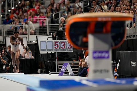 Simone Biles performs on the vault